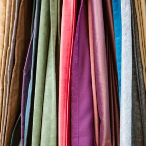 different types of curtains and fabrics hanging close-up