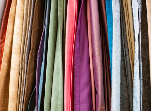 different types of curtains and fabrics hanging
